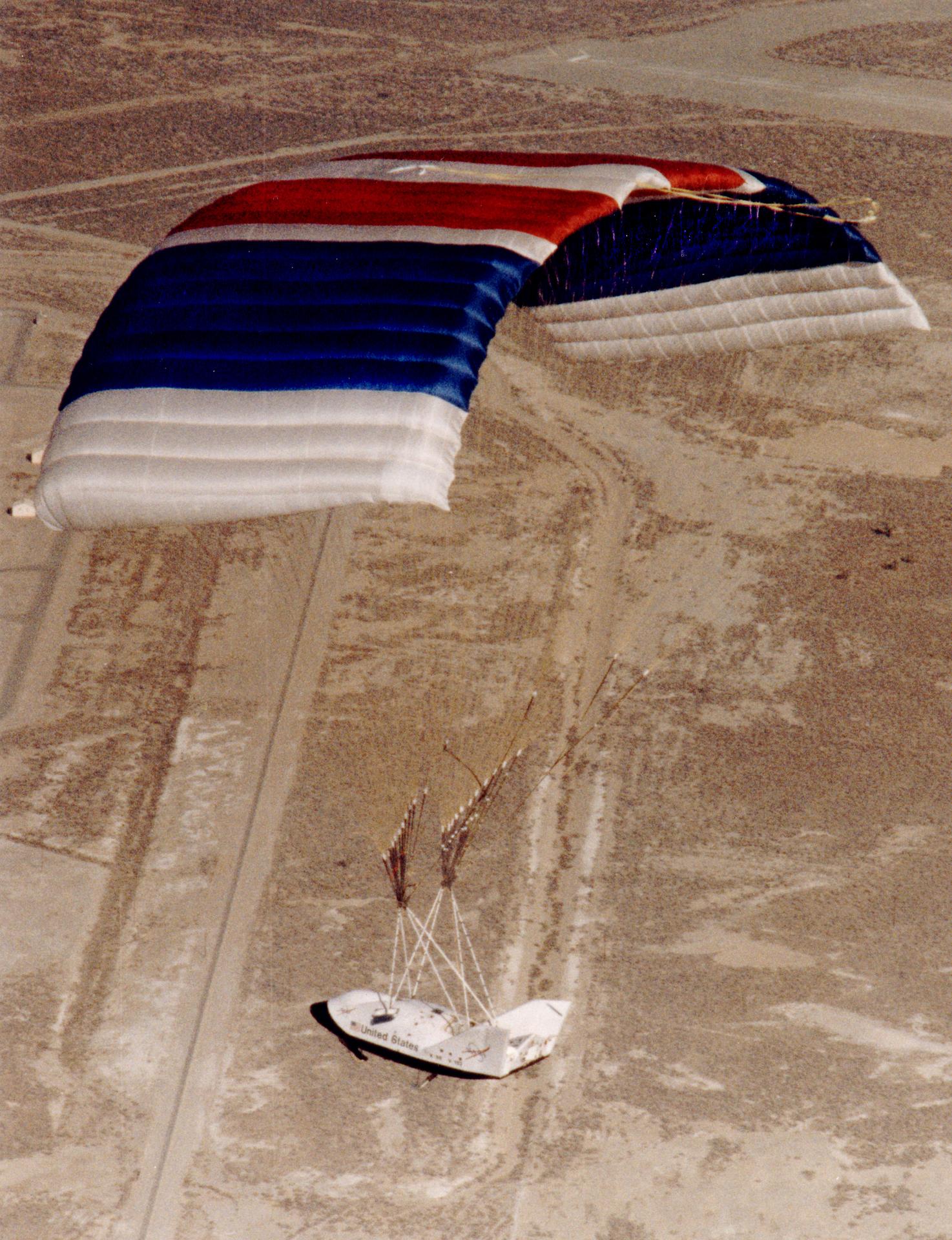 NASA's X-38 crew-return vehicle demonstrator flies under its giant ram-air parafoil — the closest proven analogue to parafoil stage recovery (NASA)