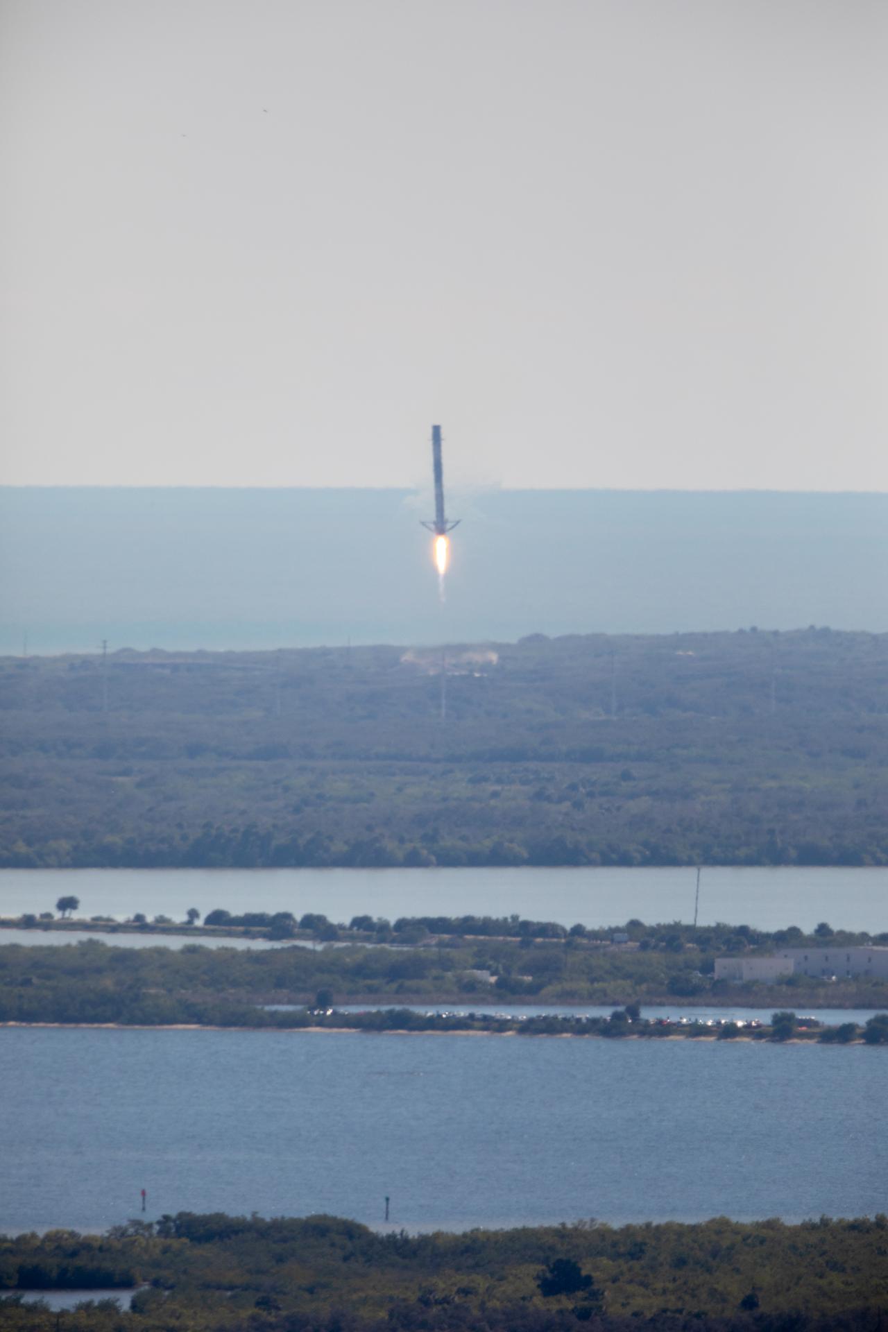 Falcon 9 first stage returning for landing after the NG-20 launch