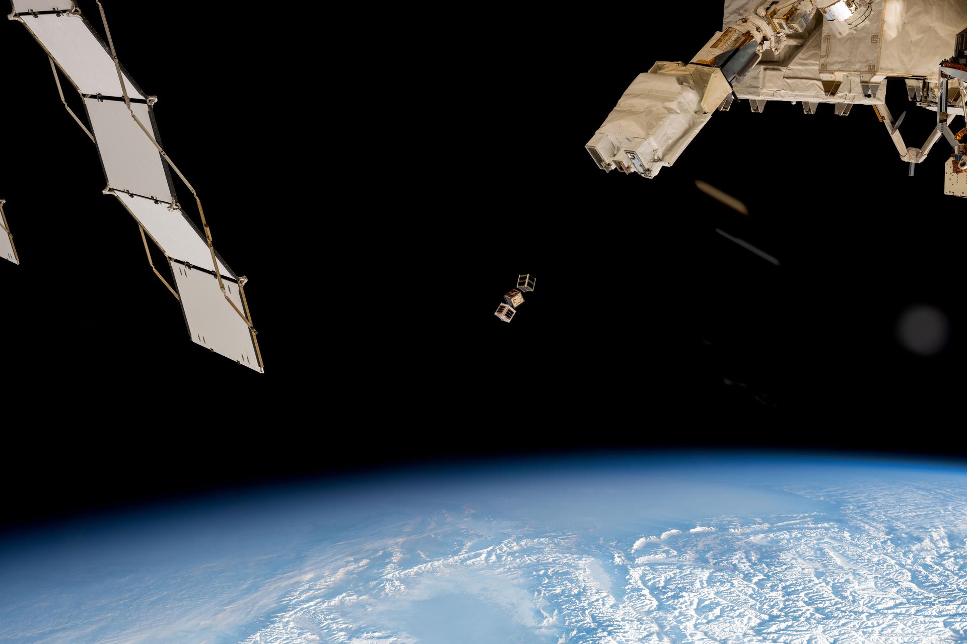 A trio of small satellites is ejected into Earth orbit from the International Space Station (NASA)