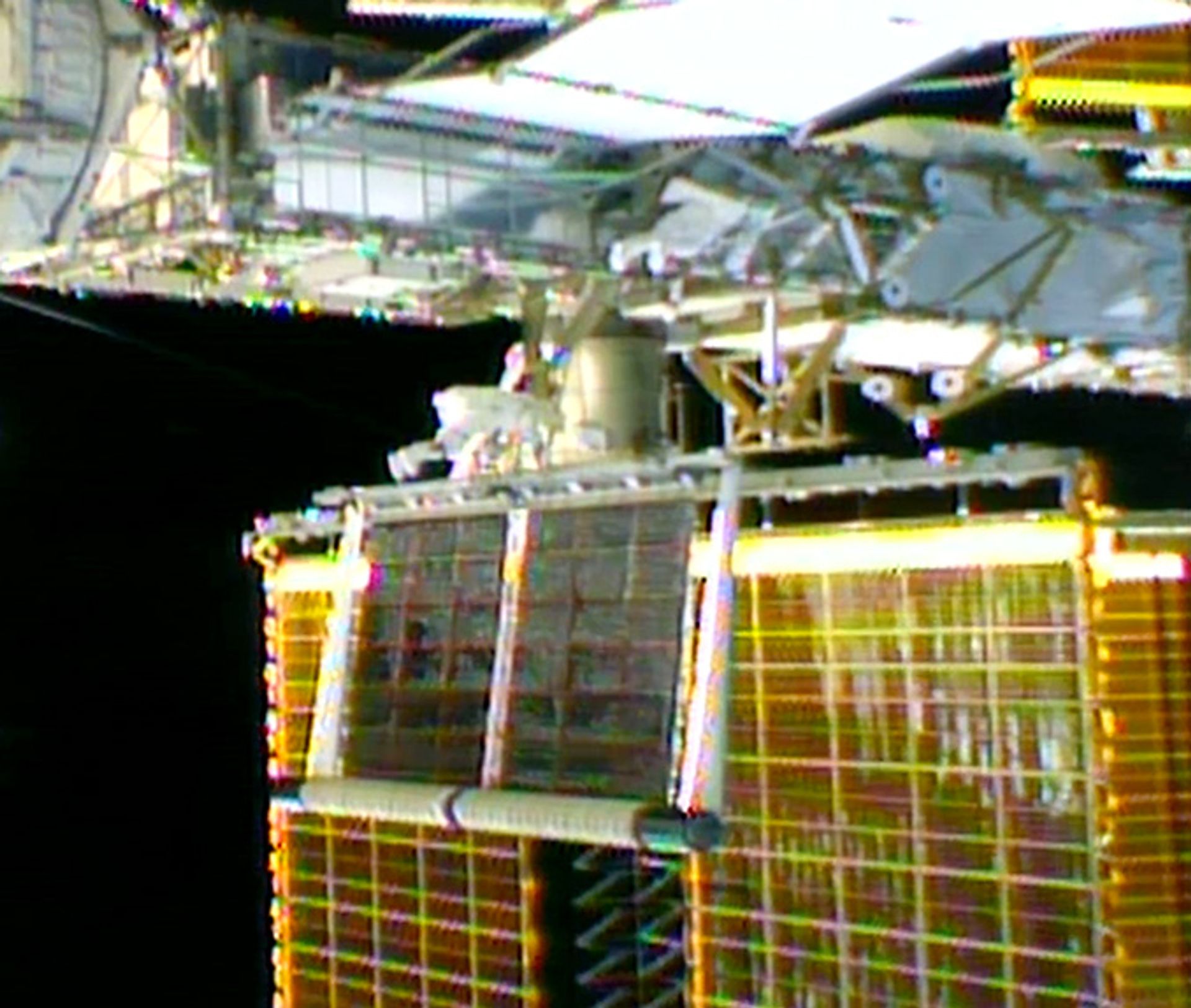 Spacewalking astronauts unfurl upgraded solar array to boost space station power